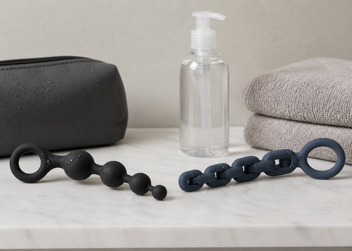 Anal Beads guide product scene with flexible bead strand, firmer bead chain, water-based lube