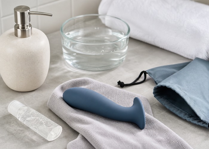 Prostate Massagers guide product scene with curved silicone massager, flared base, handle control