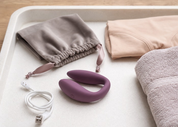 Wearable Vibrators guide product scene with wearable vibrator, soft pouch, charging cable