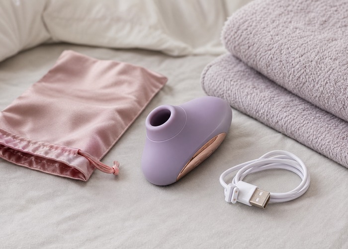 Clitoral Suction Vibrators guide product scene with soft cup opening, water-based lube, folded towel