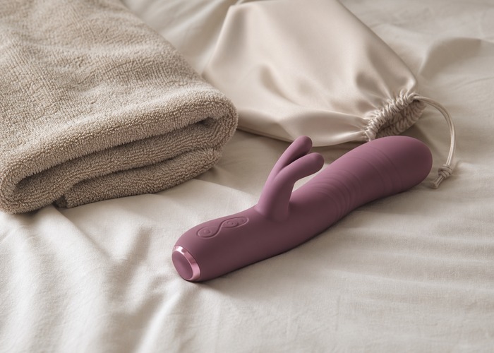 Rabbit Vibrators guide product scene with smooth shaft, raised texture, charging cable