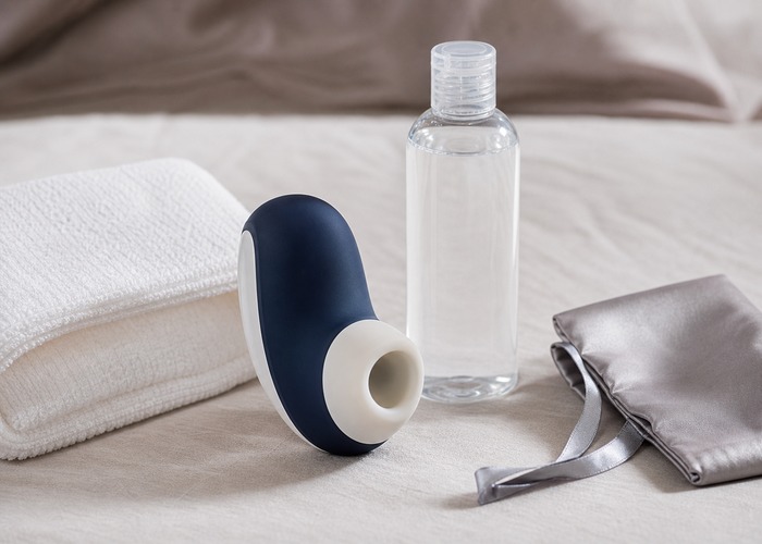 Clitoral Suction Vibrators guide product scene with soft cup opening, water-based lube, folded towel