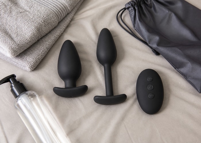 Remote Control Butt Plugs guide product scene with remote control butt plug, flared base, water-based lube